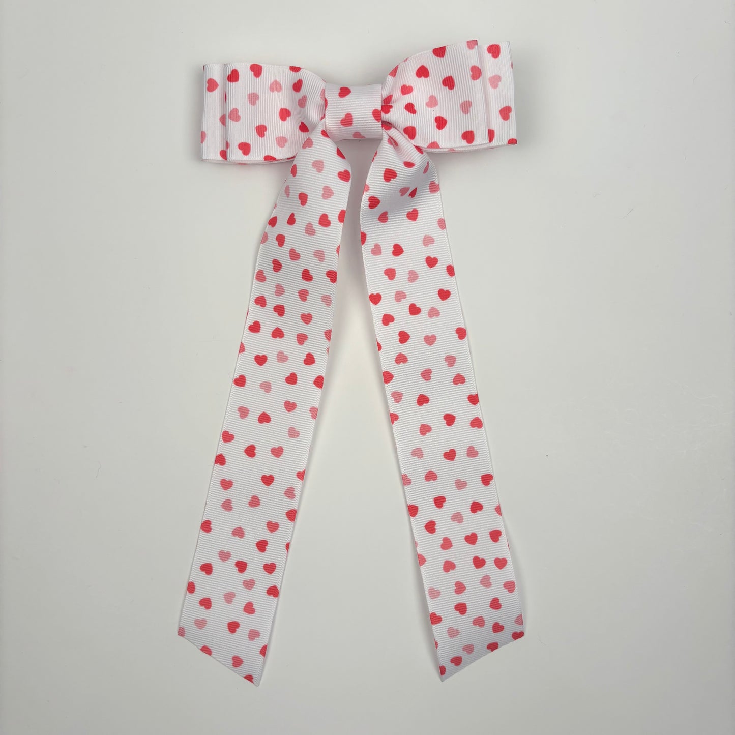 A Cupid Collection Grosgrain Printed Hearts Bow