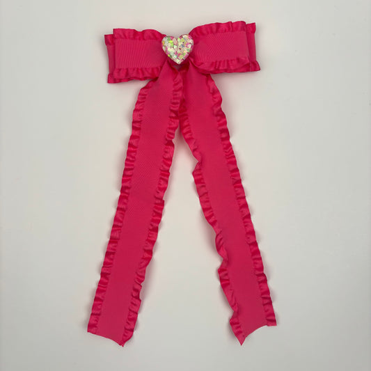 A Cupid Collection Ruffle Pink Bow w/ Heart Embellishment