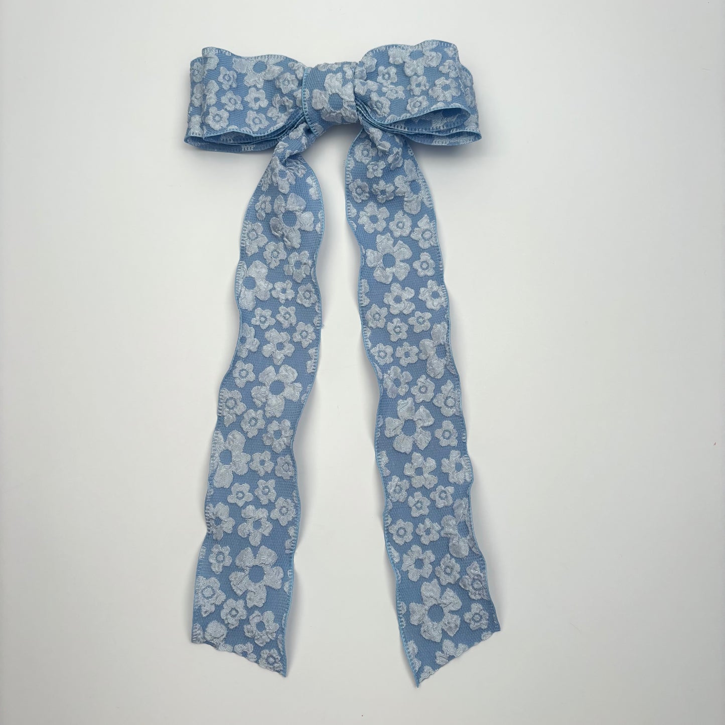 A Spring Embossed Floral Blue Bow