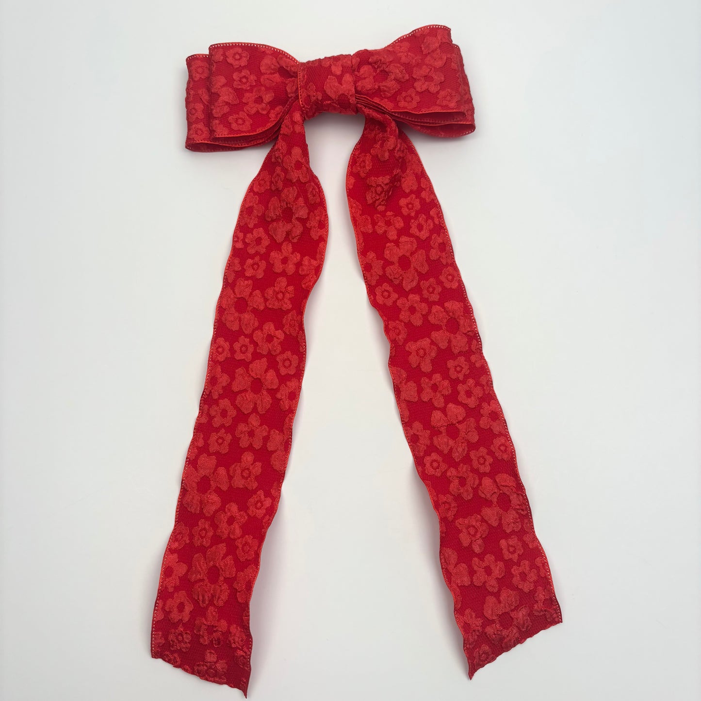 A Spring Embossed Floral Red Bow