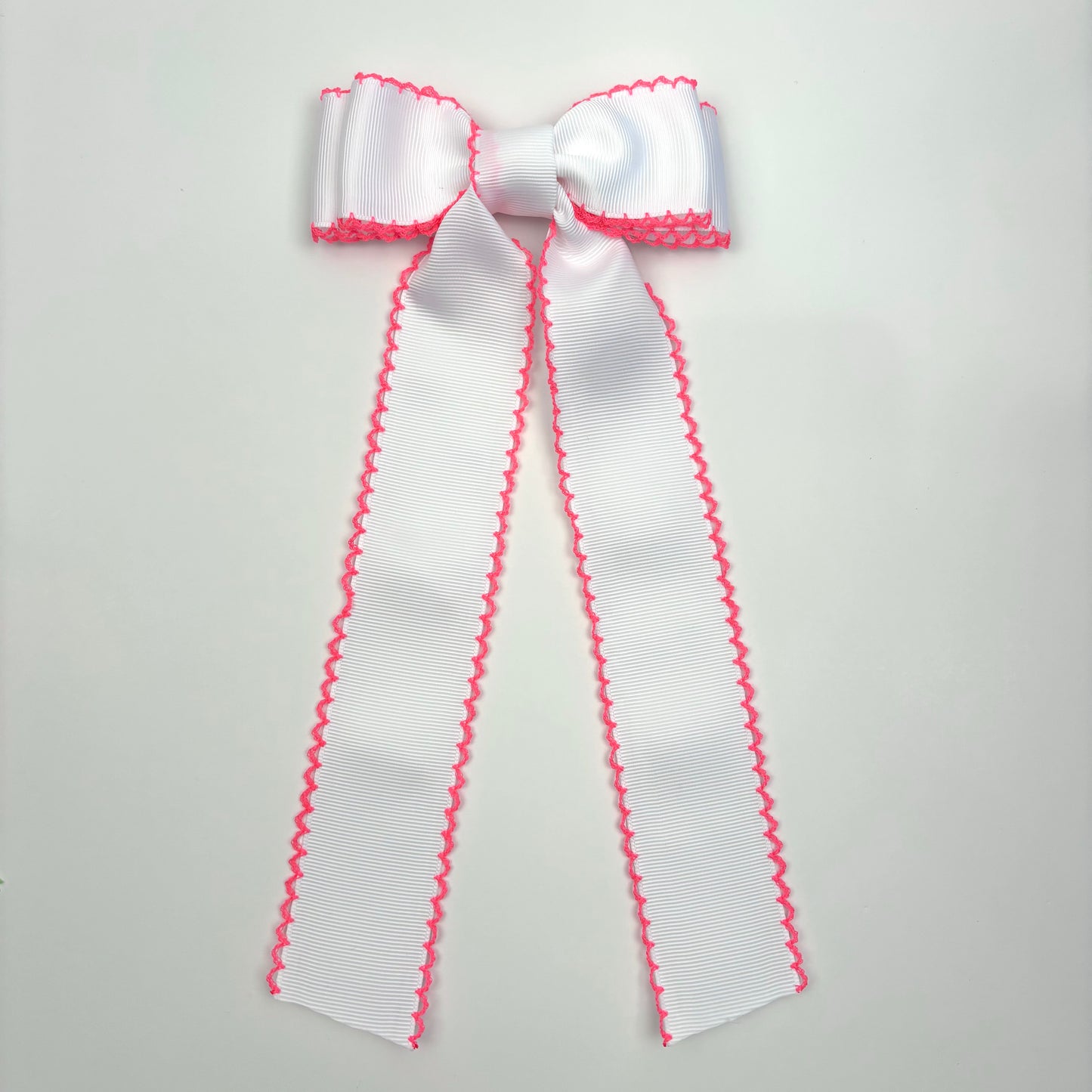 A Spring Moonstitch White Neon Pink Bow